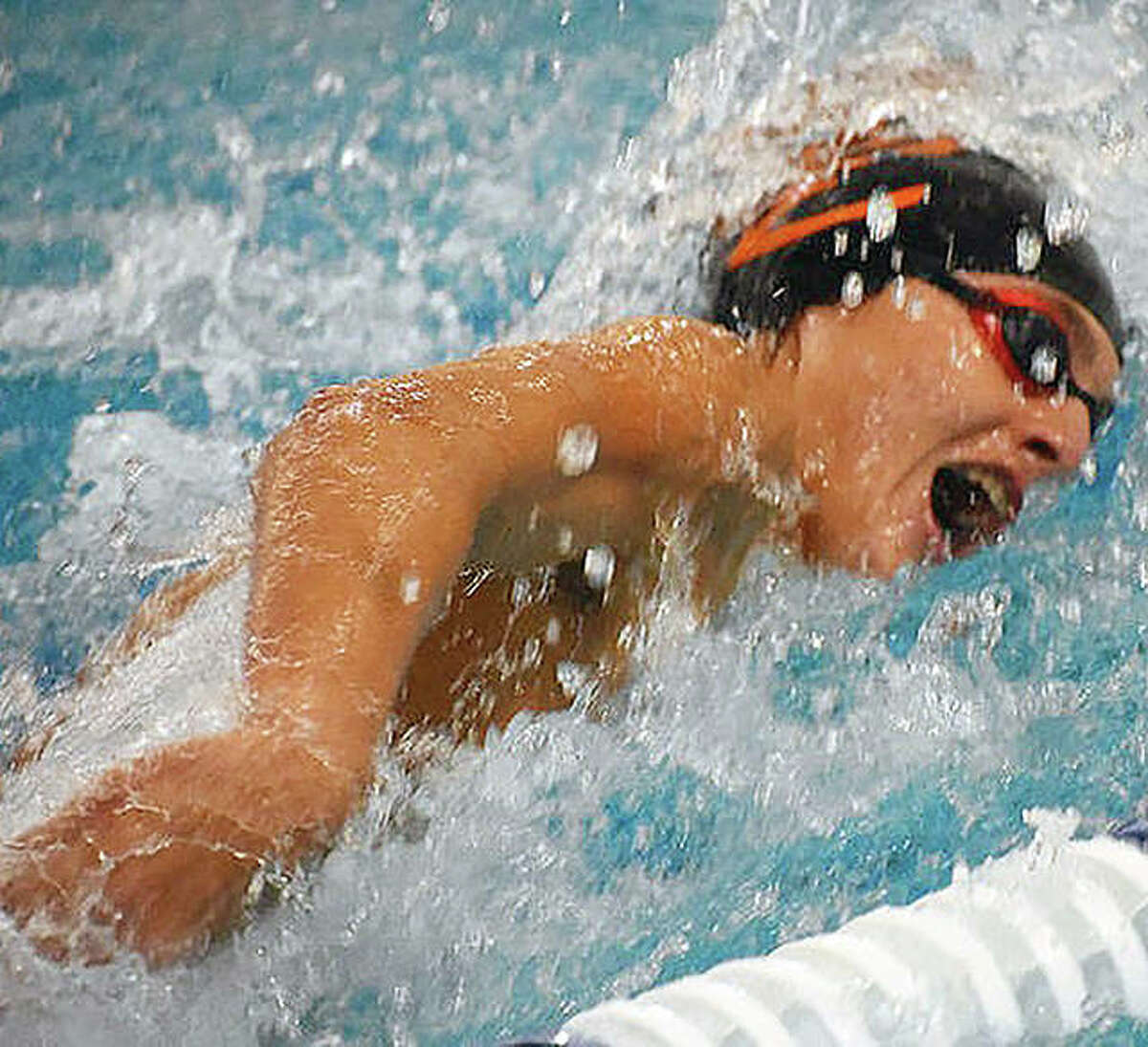 Evan Grinter of Edwardsville won the 50-yard freestyle in his team's quad meet win over Chatham Glenwood, Springfield and O'Fallon at the Chuck Fruit Aquatic Center.