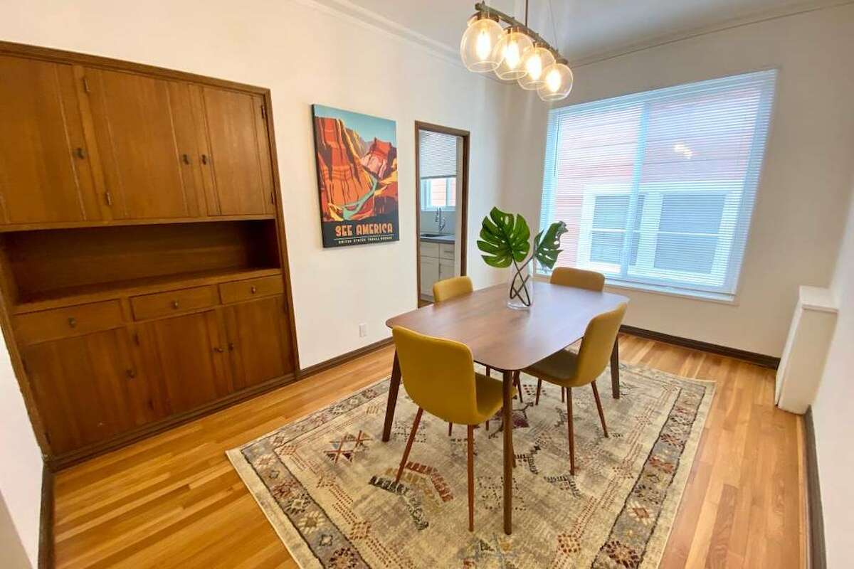 There's a formal living room and dining room, one of which could be used as a second bedroom if roommates desired. There's built in cabinetry in the dining room. Doors close between the rooms.