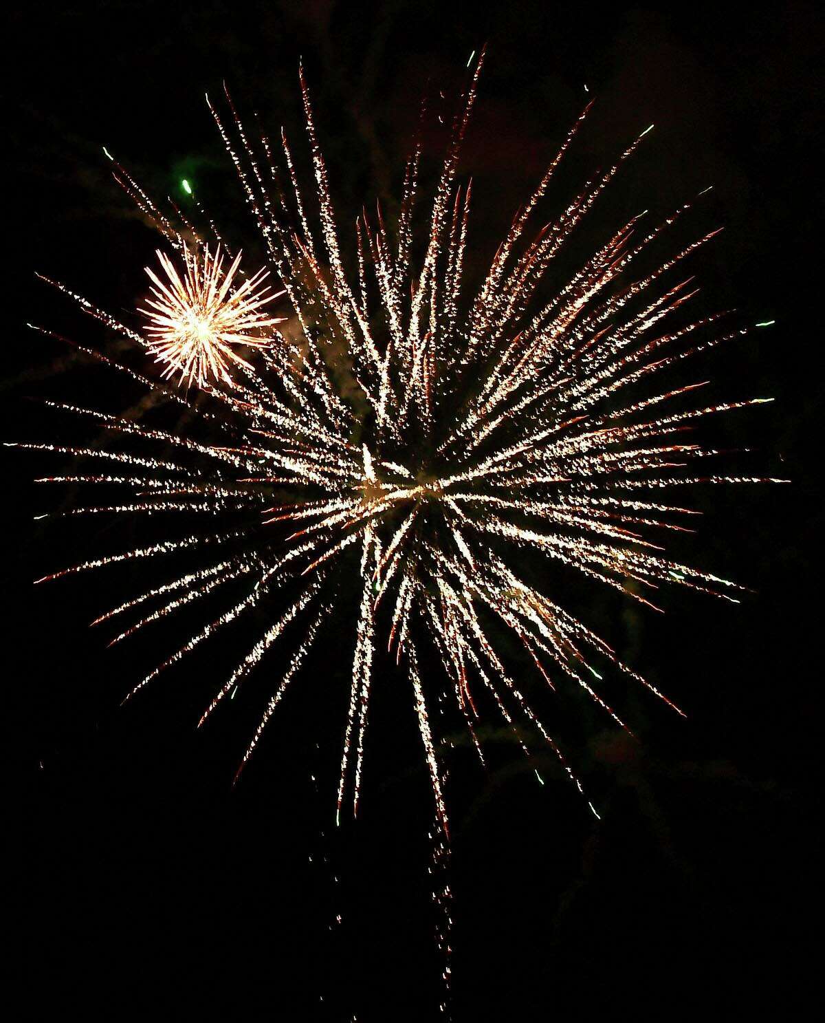 Residents enjoy the Darien 2021 Fireworks Display at Darien High School Thursday, July 23, 2021, in Darien, Conn. Last year's display was cancelled due to the pandemic.