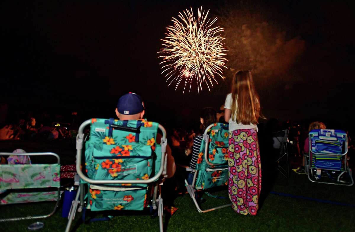 Residents enjoy the Darien 2021 Fireworks Display at Darien High School Thursday, July 23, 2021, in Darien, Conn. Last year's display was cancelled due to the pandemic.
