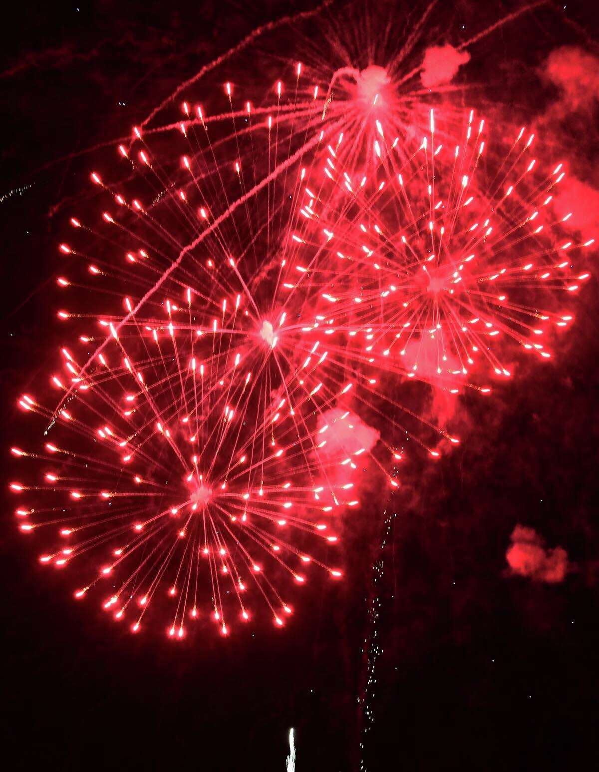 Residents enjoy the Darien 2021 Fireworks Display at Darien High School Thursday, July 23, 2021, in Darien, Conn. Last year's display was cancelled due to the pandemic.