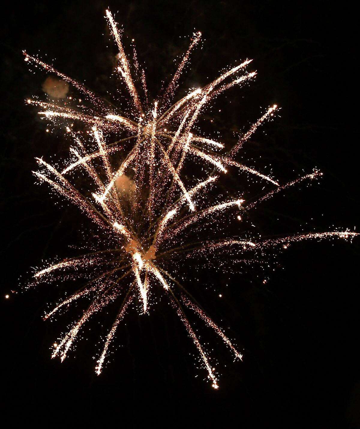 Residents enjoy the Darien 2021 Fireworks Display at Darien High School Thursday, July 23, 2021, in Darien, Conn. Last year's display was cancelled due to the pandemic.