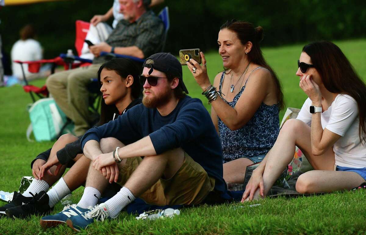 Residents enjoy the sounds of the Jerry Weiss Project during the Darien 2021 Fireworks Display at Darien High School Thursday, July 23, 2021, in Darien, Conn. Last year's display was cancelled due to the pandemic.
