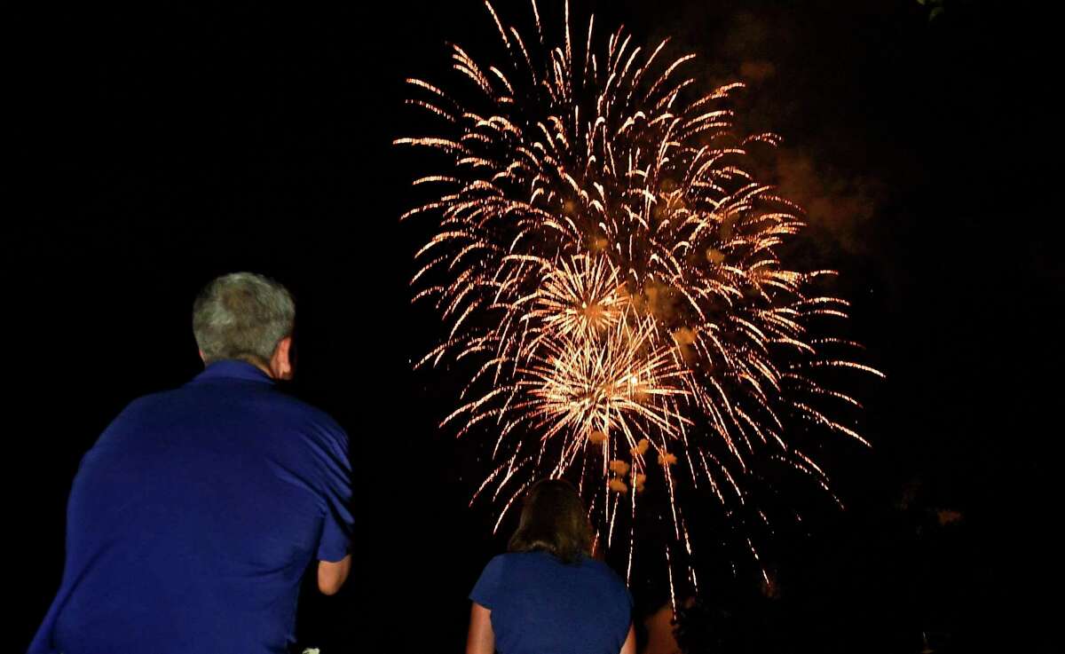 Residents enjoy the Darien 2021 Fireworks Display at Darien High School Thursday, July 23, 2021, in Darien, Conn. Last year's display was cancelled due to the pandemic.