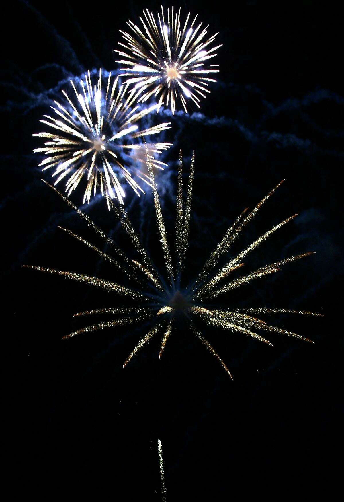 Residents enjoy the Darien 2021 Fireworks Display at Darien High School Thursday, July 23, 2021, in Darien, Conn. Last year's display was cancelled due to the pandemic.