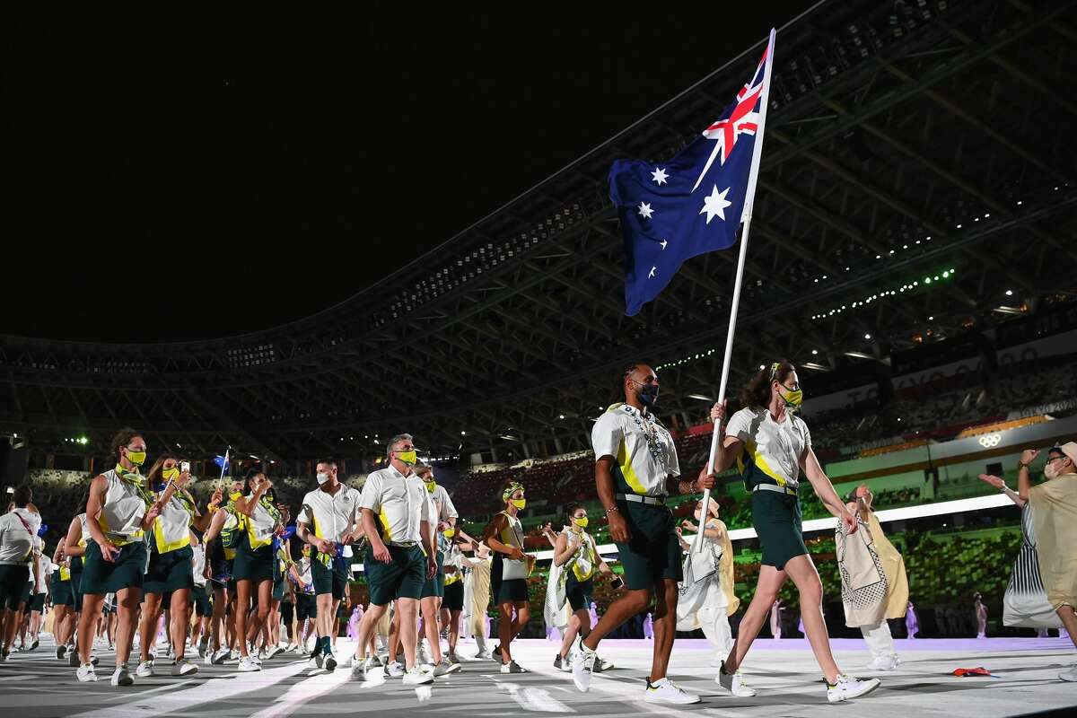 TOKYO, JAPAN - JULY 23: Team Australia flag bearers Cate Campbell and Patty Mills lead their team during the Tokyo 2020 Olympic Games Opening Ceremony at Olympic Stadium on July 23, 2021 in Tokyo, Japan.  (Photo by Matthias Hangst / Getty Images)