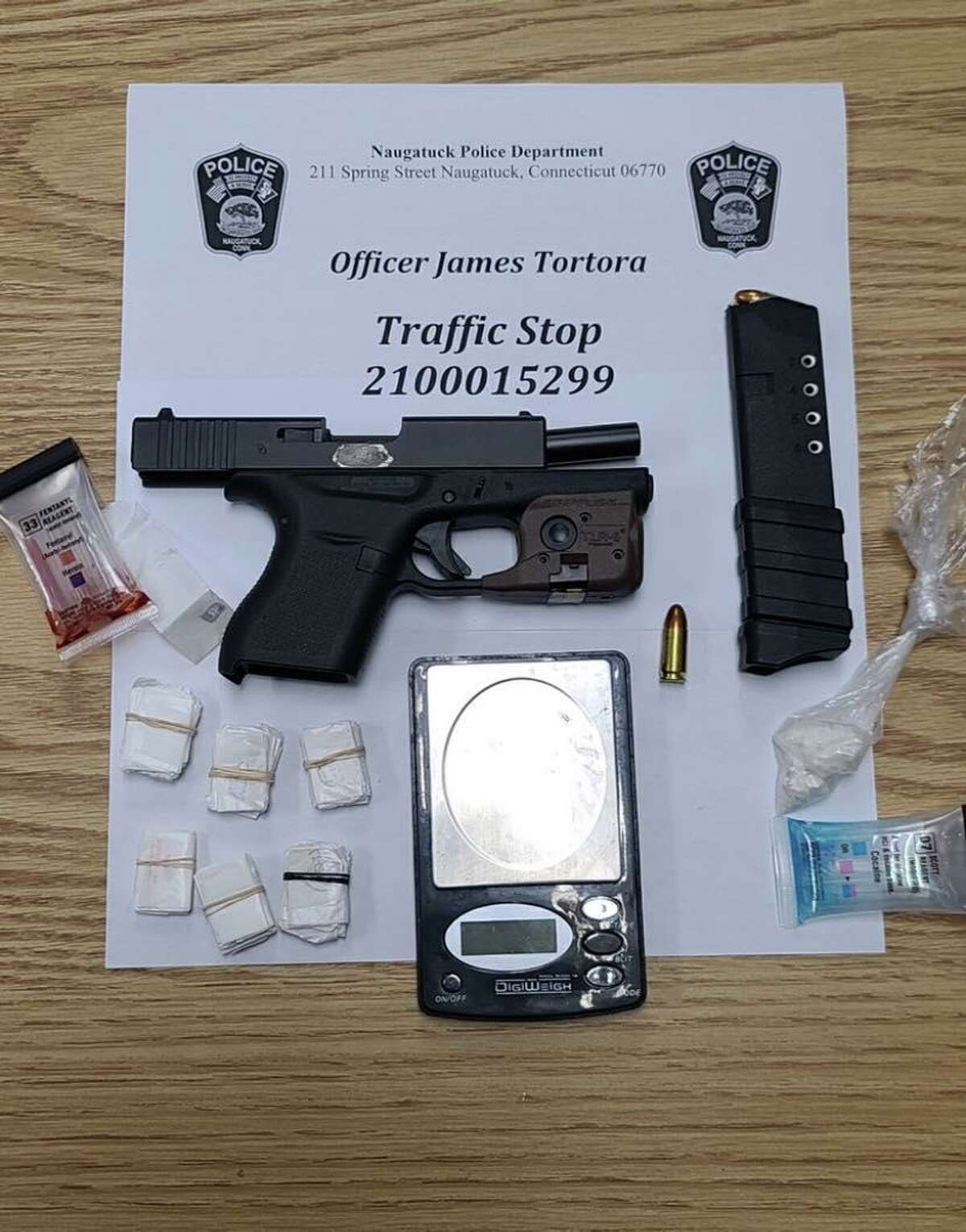 Police said investigators found a Glock pistol with an obliterated serial number, 56 bags of fentanyl and 7.2 grams of crack cocaine in an abandoned vehicle in Waterbury, Conn., after the vehicle fled a traffic stop in Naugatuck.
