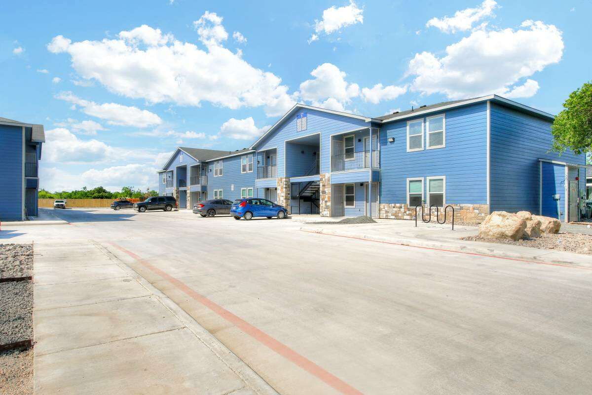 These new, blue apartments near one of San Antonio's biggest college communities and comes with one assigned parking spot. 