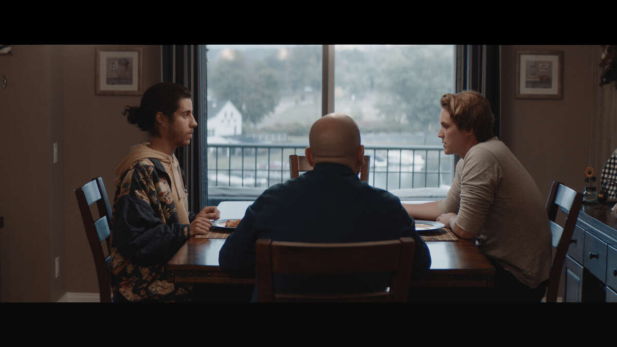 Short horror film "Family History" was co-produced by Danbury, Conn. resident Tom Ciuba and filmed at his Candlewood Lake home in October 2019. A scene from the film depicts lead characters Evan (left) and Sam (right) who visit Sam's father (center) on the anniversary of his mother's death. 