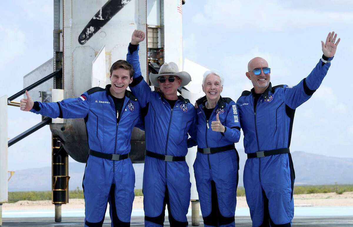 Jeff Bezos, second from left, celebrates with his Blue Origin’s New Shepard crew. What’s not to love about billionaires like Bezos investing in new horizons?