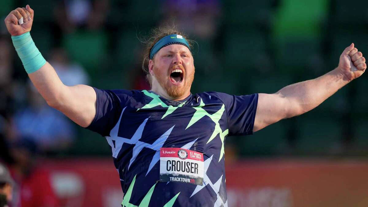 Ryan Crouser celebrates after setting a world record during the finals of men's shot put at the U.S. Olympic Track and Field Trials Friday, June 18, 2021, in Eugene, Ore. (AP Photo/Charlie Riedel)