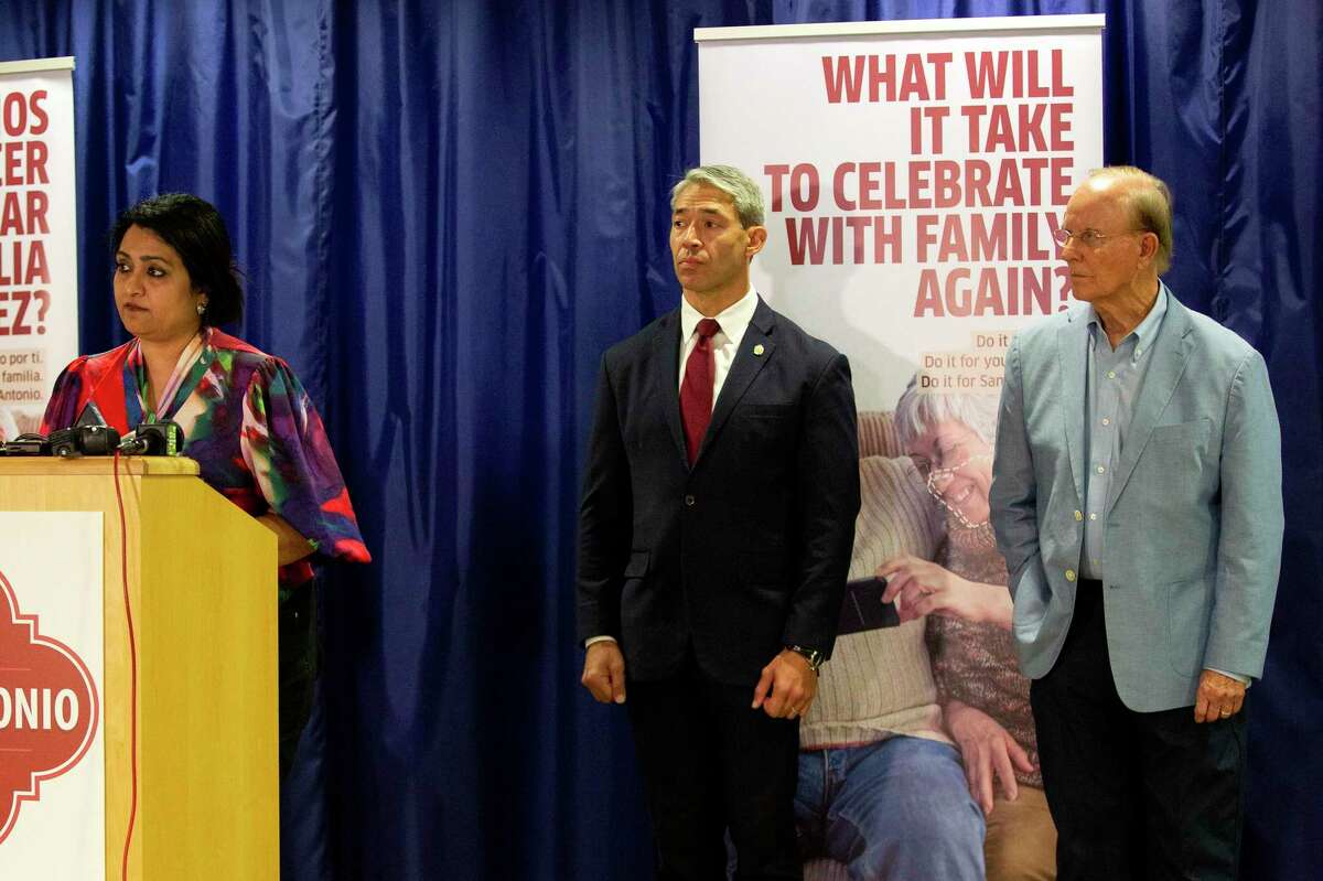 Dr. Anita Kurian, assistant director of Metro Health’s Communicable Disease Division, speaks Friday as officials address the uptick in recent COVID-19 cases. Mayor Ron Nirenberg and Bexar County Judge Nelson Wolff stand beside her.