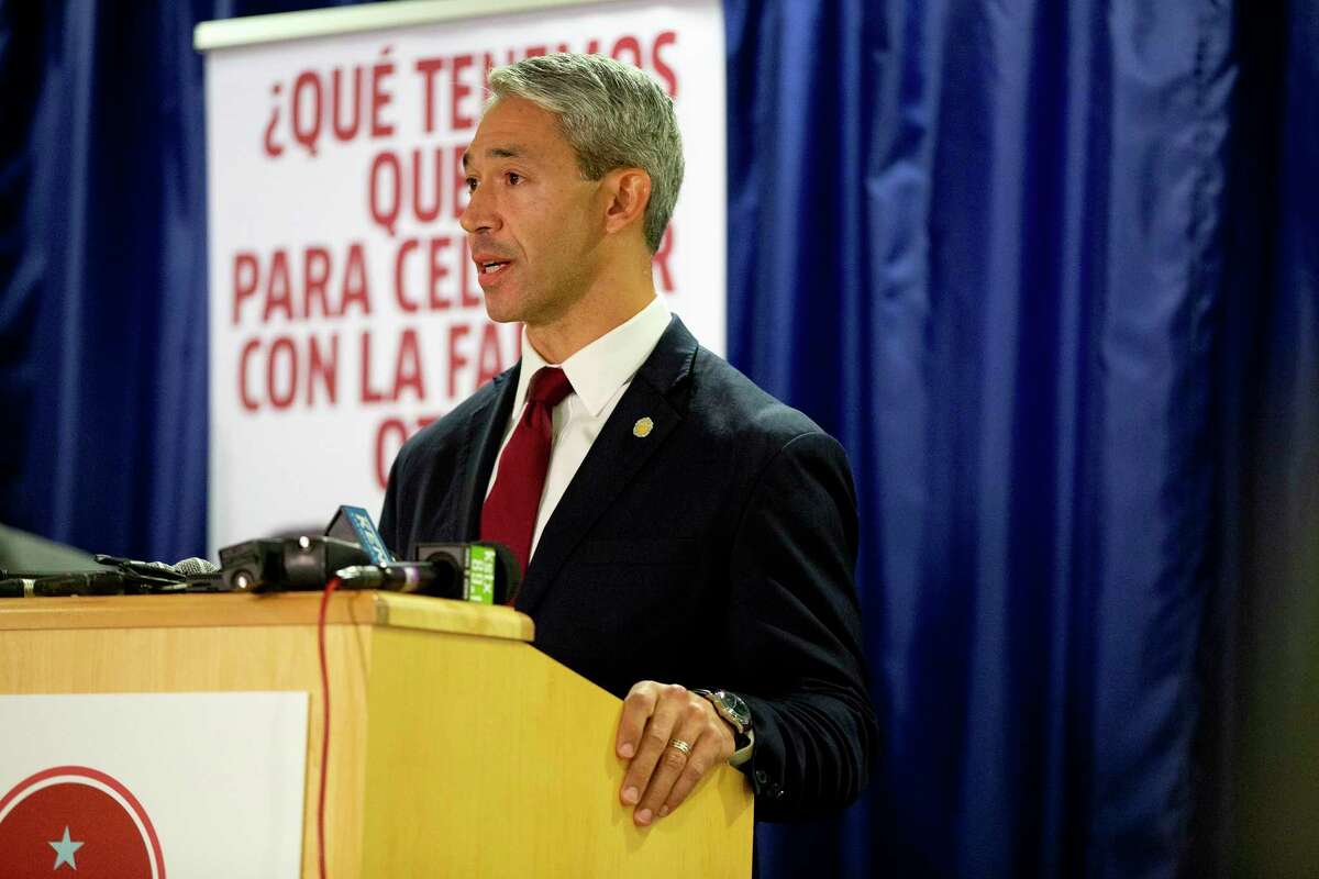 San Antonio Mayor, Ron Nirenberg speaks at a press conference surrounded by city officials about the uptick in recent COVID cases.