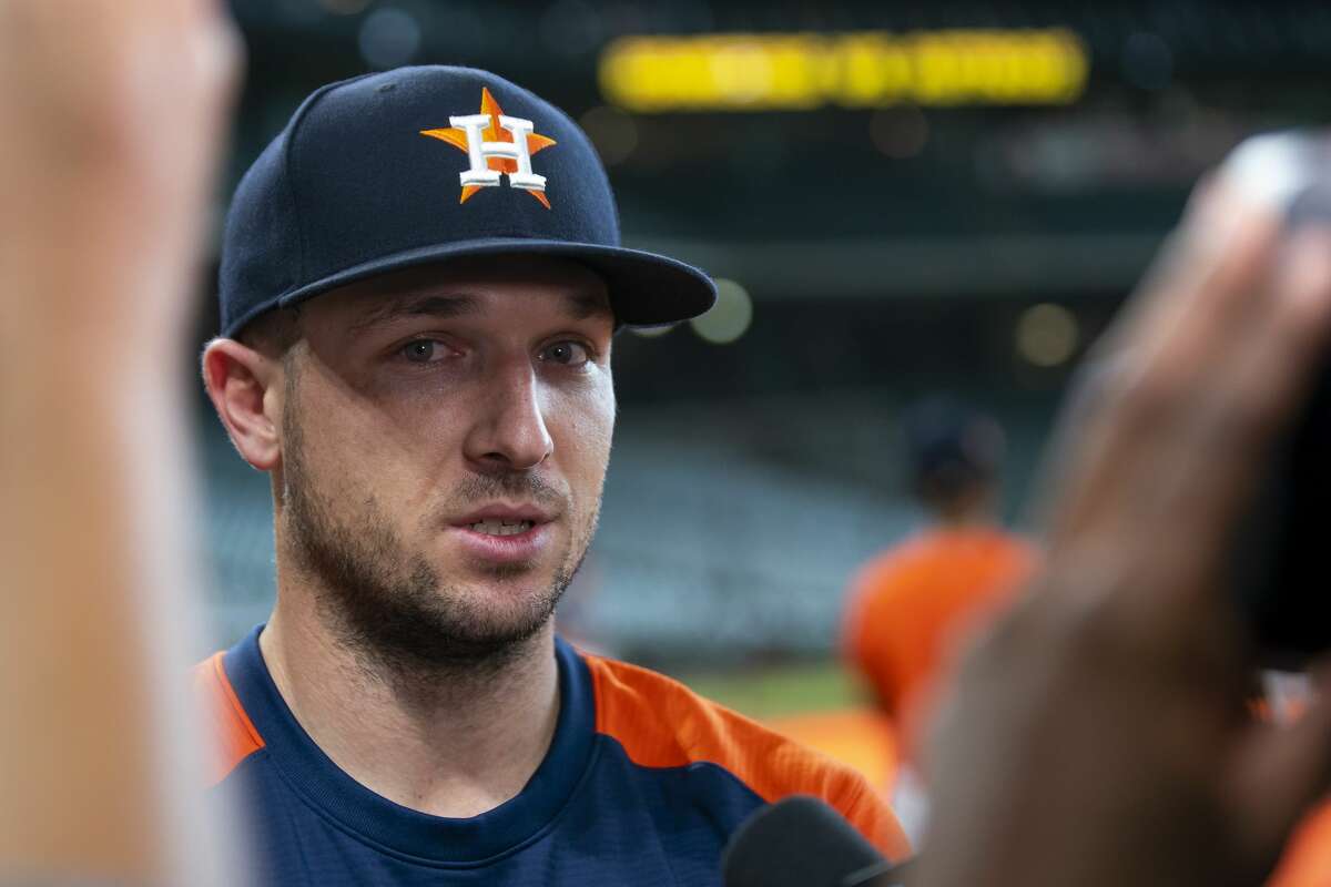 Houston Astros third baseman Alex Bregman talks with members of the media during batting practice before a game between the Houston Astros and Texas Rangers on Friday, July 23, 2021, at Minute Maid Park in Houston.
