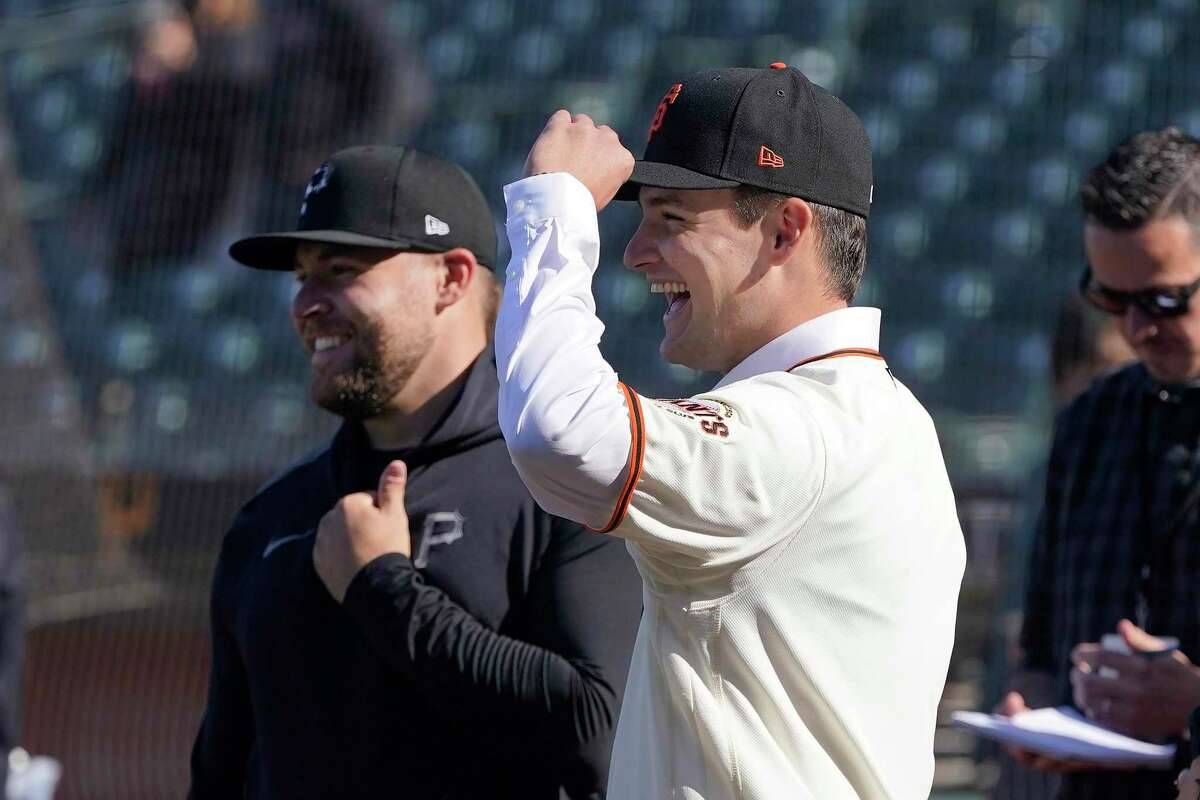 San Francisco Giants draft pick Will Bednar, foreground, smiles as he talks with his brother, Pittsburgh Pirates pitcher David Bednar, left, before a baseball game between the Giants and the Pirates in San Francisco, Friday, July 23, 2021. (AP Photo/Jeff Chiu)