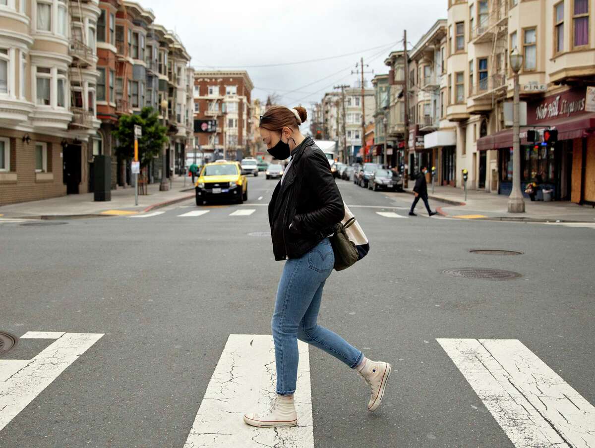 Becca Camping of San Francisco, shown walking along Hyde Street in January, was one of thousands of Californians who whose legitimate unemployment insurance payments were frozen by the state Economic Development Department.