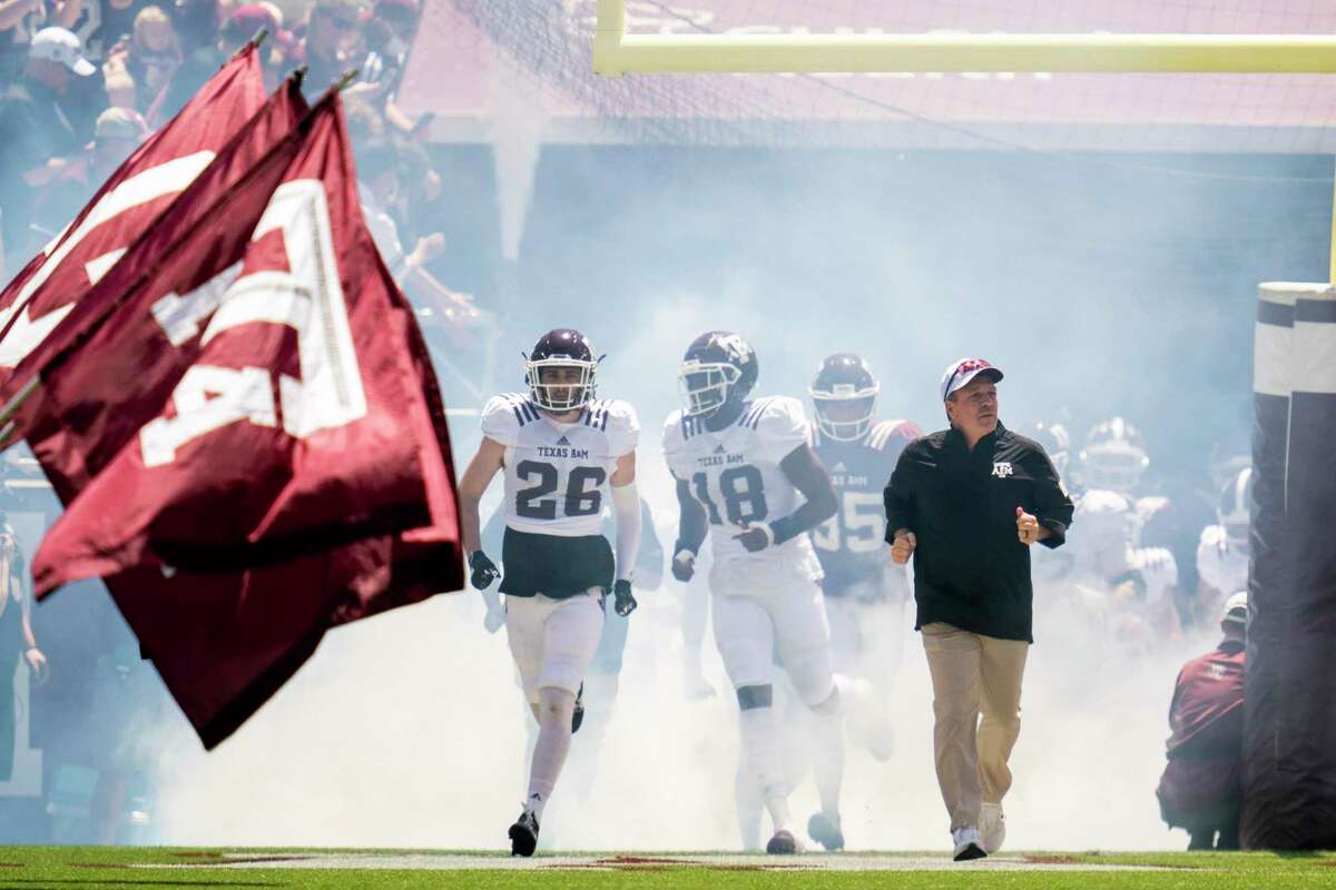 Texas A&M head coach Jimbo Fisher leads the Aggies on Kyle Field before the start of the Texas A&M Maroon and White Spring game in College Station, Texas on Saturday, April 24, 2021.