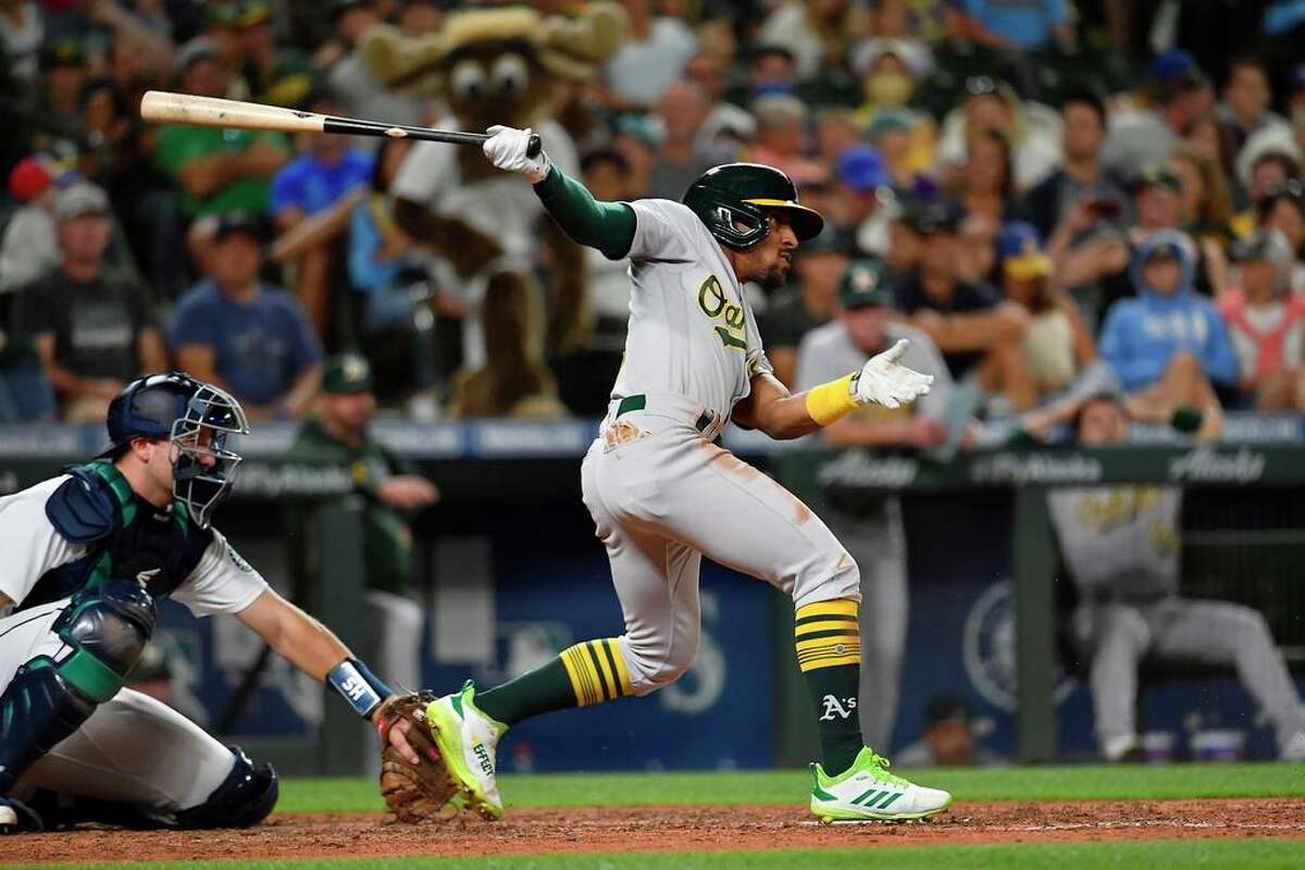 SEATTLE, WASHINGTON - JULY 24: Tony Kemp #5 of the Oakland Athletics hits the ball during the seventh inning of the game against the Seattle Mariners at T-Mobile Park on July 24, 2021 in Seattle, Washington. (Photo by Alika Jenner/Getty Images)