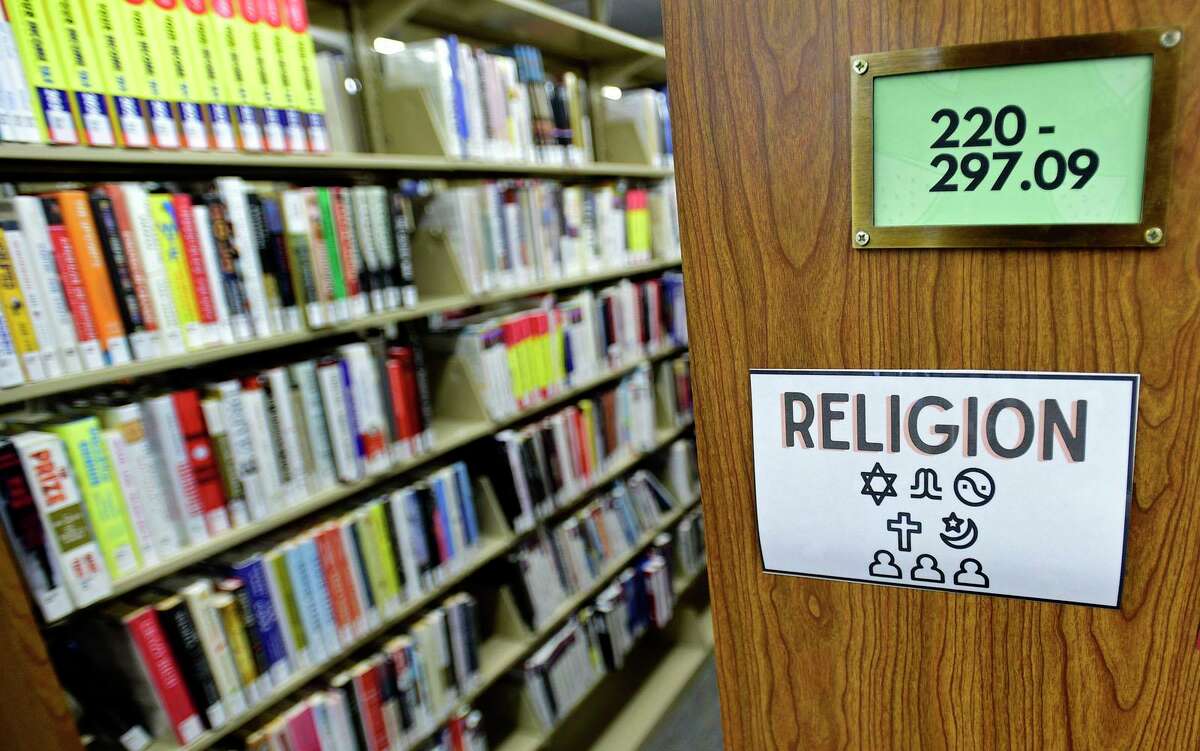 The religious text section at the Norwalk Public Library main branch, photographed on July 8.