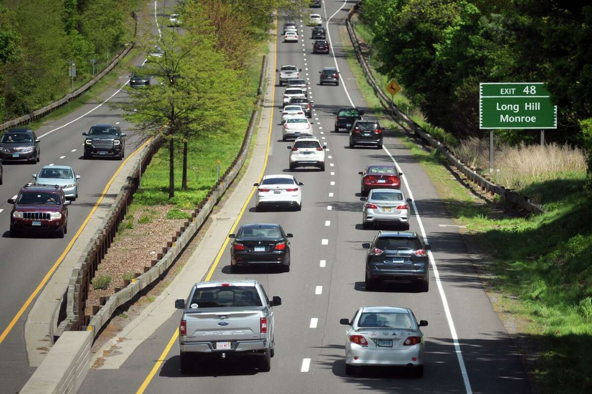 Traffic moves steadily along the Merritt Parkway, in Trumbull, Conn. May 12, 2021.