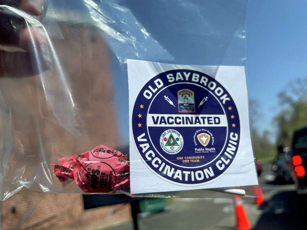 A sticker and lollipop people received after getting vaccinated at the Old Saybrook Middle School drive-through vaccine clinic.