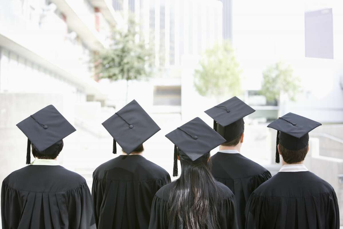 Rear view of graduates in caps and gowns