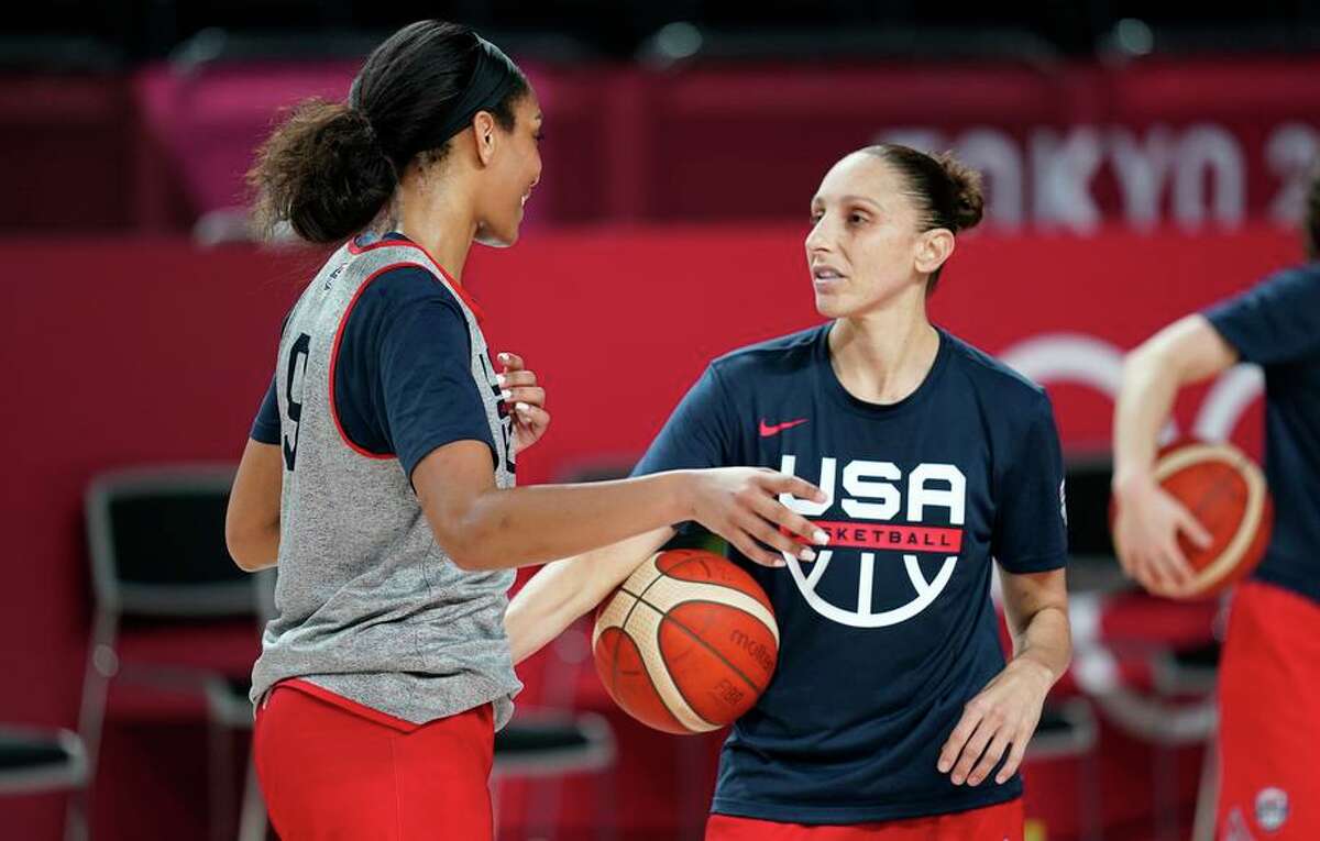 Diana Taurasi (right) talks with A’Ja Wilson during a practice in Saitama, Japan, for the U.S. women’s basketball team.
