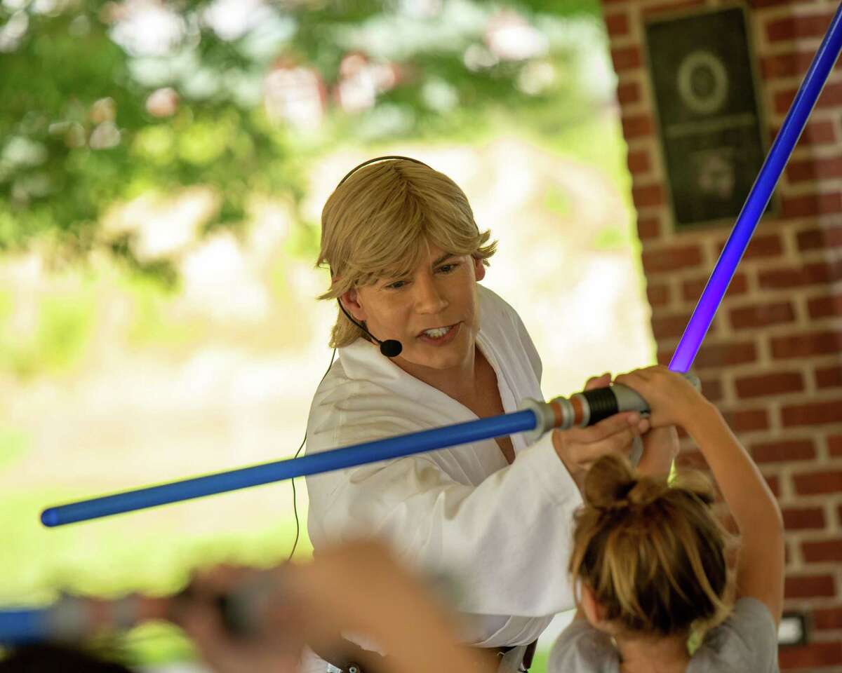 A actor portraying Luke Skywalker trains young Jedi at the Shelton Rotary as part of Jedi training sponsored by the Shelton Library System on Saturday, July 24, 2021.