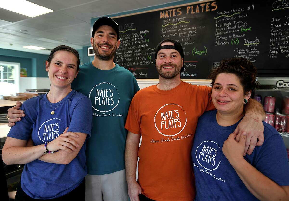 From left; Rachel Lysak, Andres Werthein, Matt McGuinness, and Caitlin Rissman at the new Nate's Plates eatery at 2 Schooner Lane in Milford, Conn. on Monday, July 26, 2021.