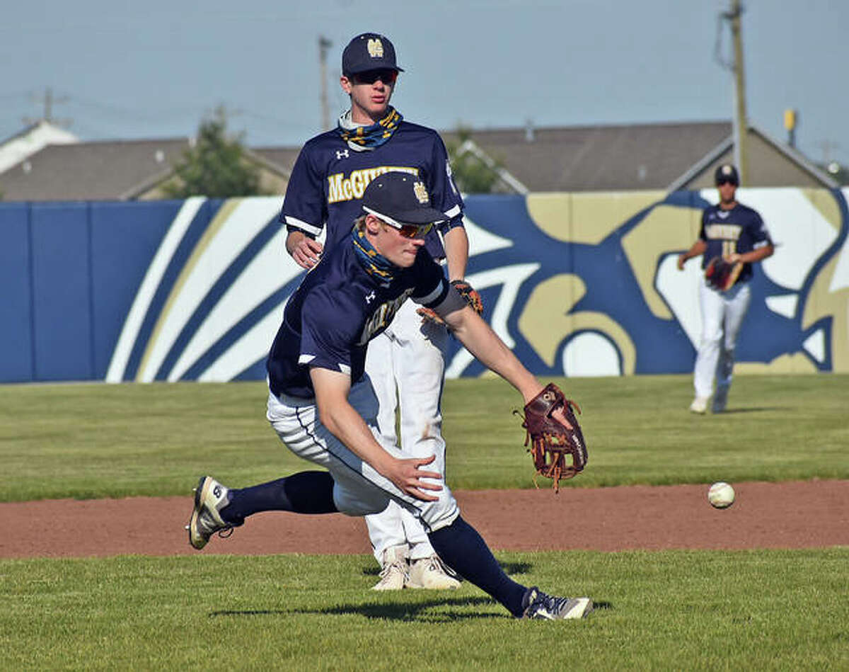 Father McGivney shortstop Matthew Gierer attempts to make a bare-handed play on a grounder against Jersey in Glen Carbon.