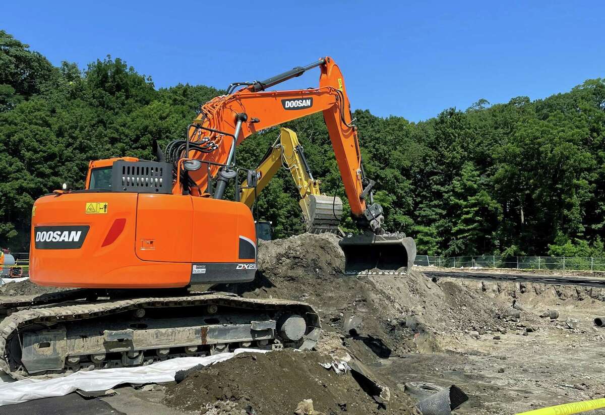 Crews work to remove contaminated soil under the athletic fields at Greenwich High School on July 26, 2021. The remediation project is progressing on schedule and will continue through the new school year.