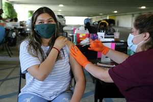 City, county could make workers get vaccinated — or tested —...