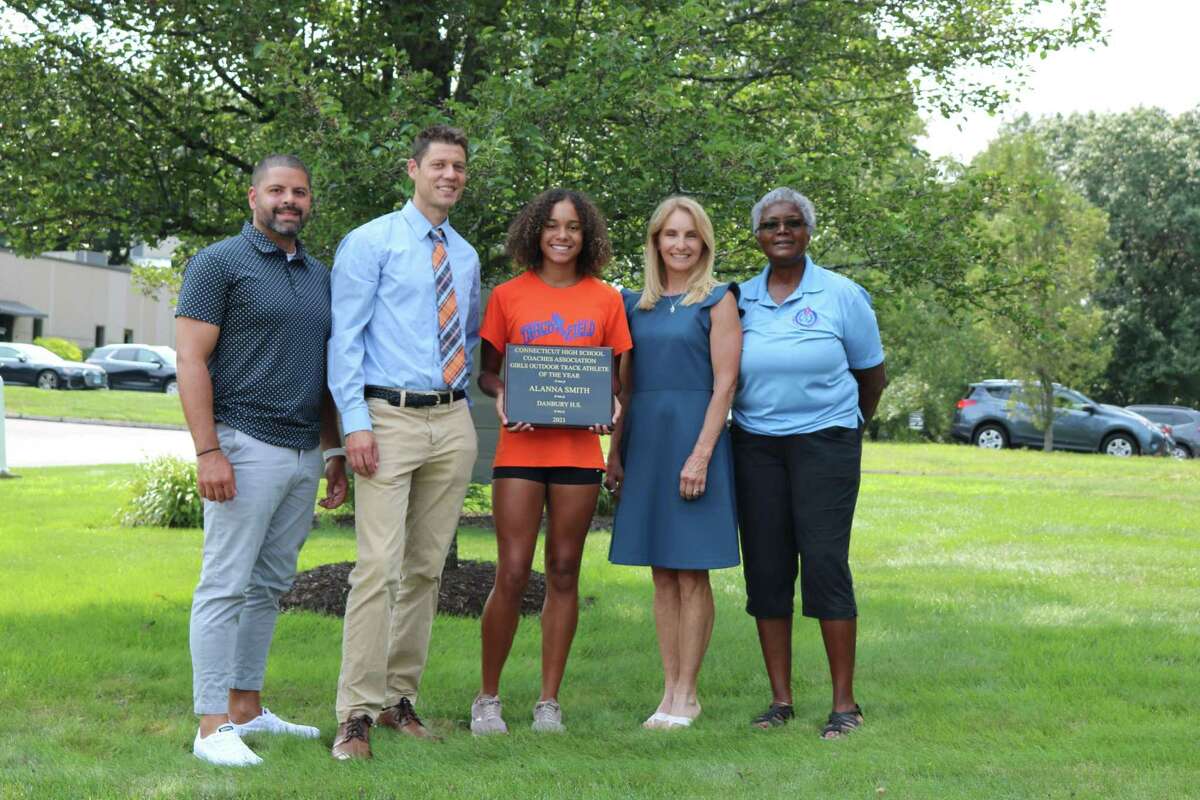 From left, Danbury coach, Danbury Head Coach Nick Fraticelli, Alanna Smith, CHSCA Girls Track Athlete of Year, Barbara Hedden - CHSCA Girls’ Outdoor Track & Field Committee Chairperson, Deb Petruzzello - CHSCA President.