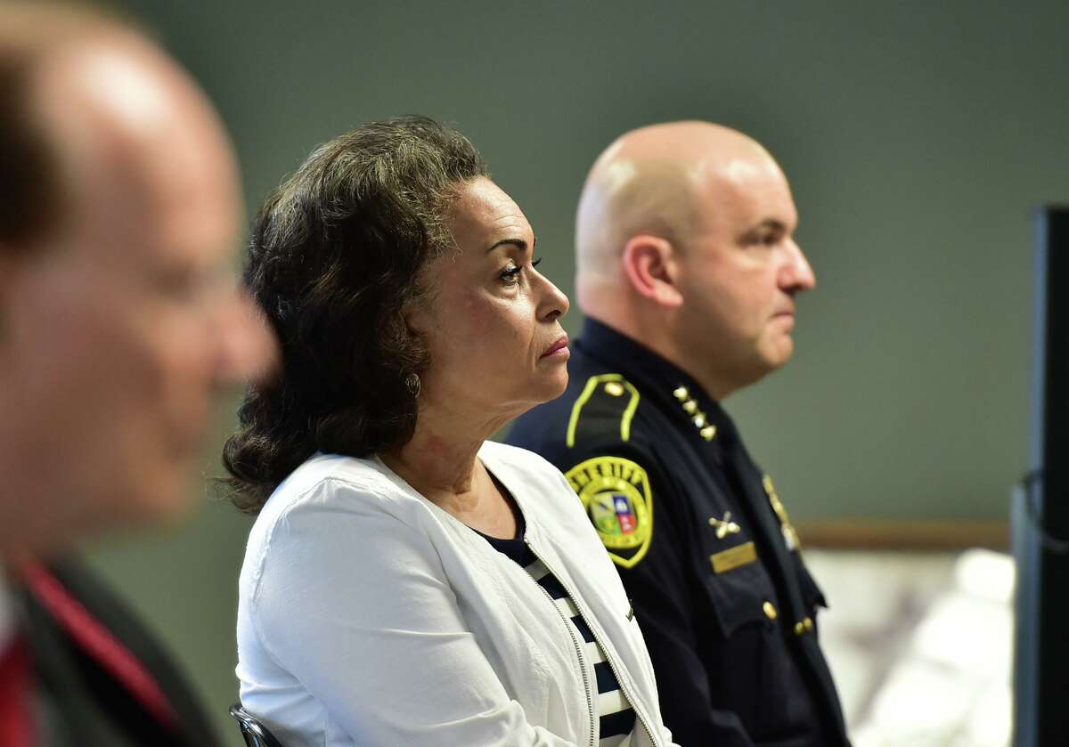 Jelynne LeBlanc Jamison, president and CEO of the Center for Heath Care Services, and Bexar County Sheriff Javier Salazar listen at a news conference highlighting the expansion of the Specialized Multidisciplinary Alternate Response Team, or SMART, Monday morning.