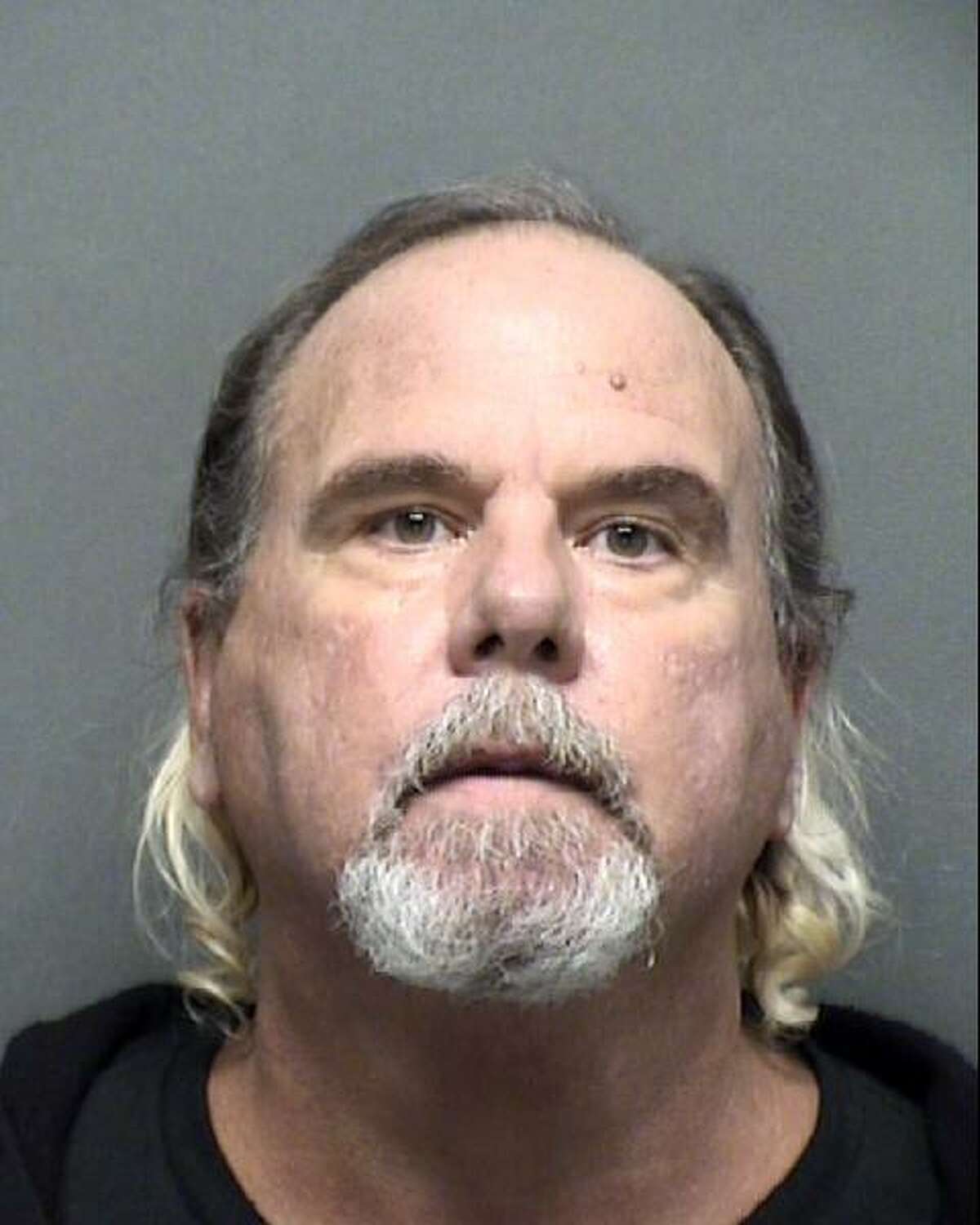 John Edward Schiller, 57, was charged with aggravated assault with a deadly weapon following a fight over a cellphone.