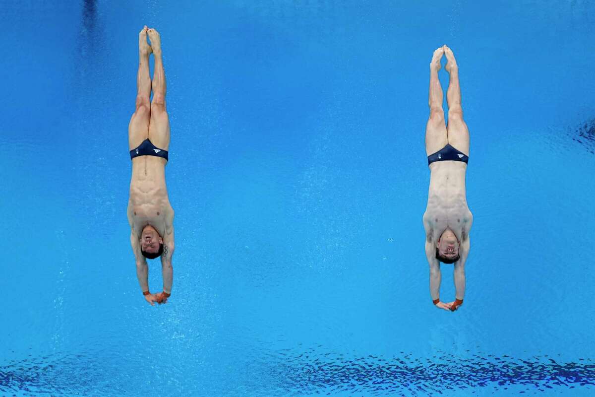 FILE - In this July 26, 2021, file photo, gold medal winners Britain's Thomas Daley and Matty Lee compete in the synchronized 10-meter platform diving final at the 2020 Summer Olympics, in Tokyo. The Tokyo Games are shaping up as a watershed for LGBTQ Olympians. Daley announced in 2013 that he was dating a man and "couldn't be happier," his coming out was an act of courage that, with its rarity, also exposed how the top echelons of sport weren't seen as a safe space by the vast majority of LGBTQ athletes.