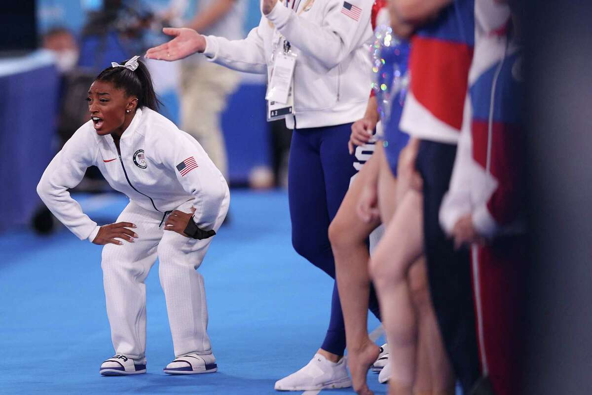 imone Biles of Team United States cheers during the Women's Team Final on day four of the Tokyo 2020 Olympic Games at Ariake Gymnastics Centre on July 27, 2021 in Tokyo, Japan.