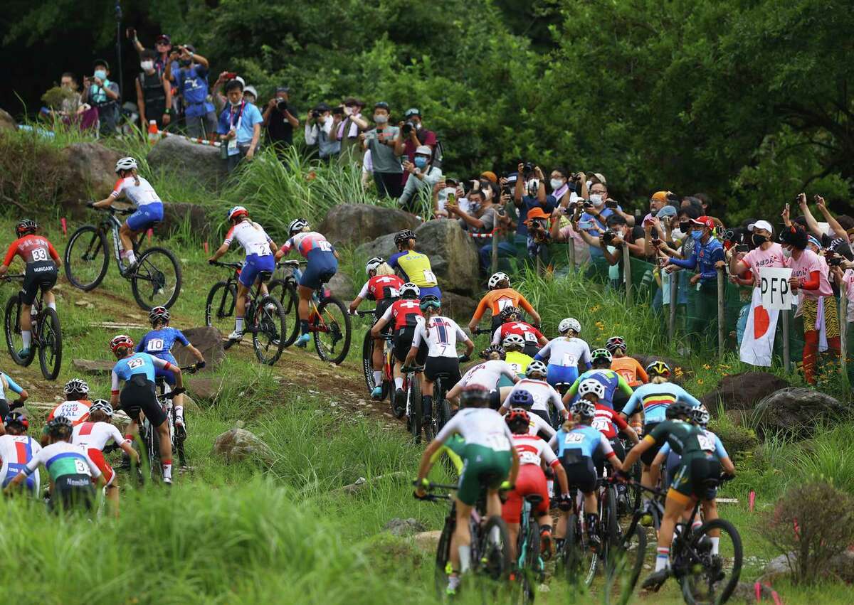 IZU, JAPAN - JULY 27: A general view of Pauline Ferrand Prevot of Team France, Kate Courtney of Team United States and the peloton during the Women's Cross-country race on day four of the Tokyo 2020 Olympic Games at Izu Mountain Bike Course on July 27, 2021 in Izu, Shizuoka, Japan. (Photo by Tim de Waele/Getty Images)