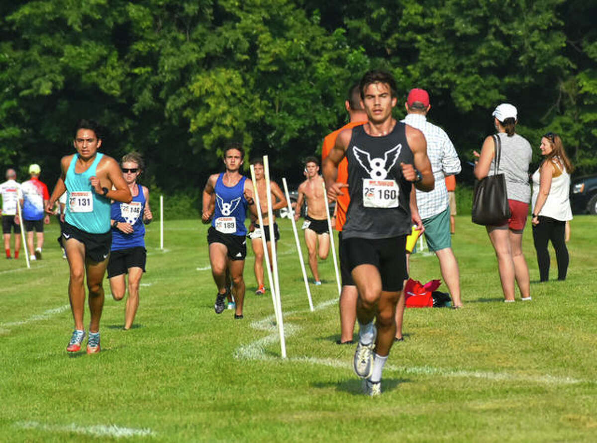 Edwardsville High School graduate Francesco Romano leads Mud Mountain at approximately the one-mile mark of the race on the SIUE cross country course on Saturday in Edwardsville.