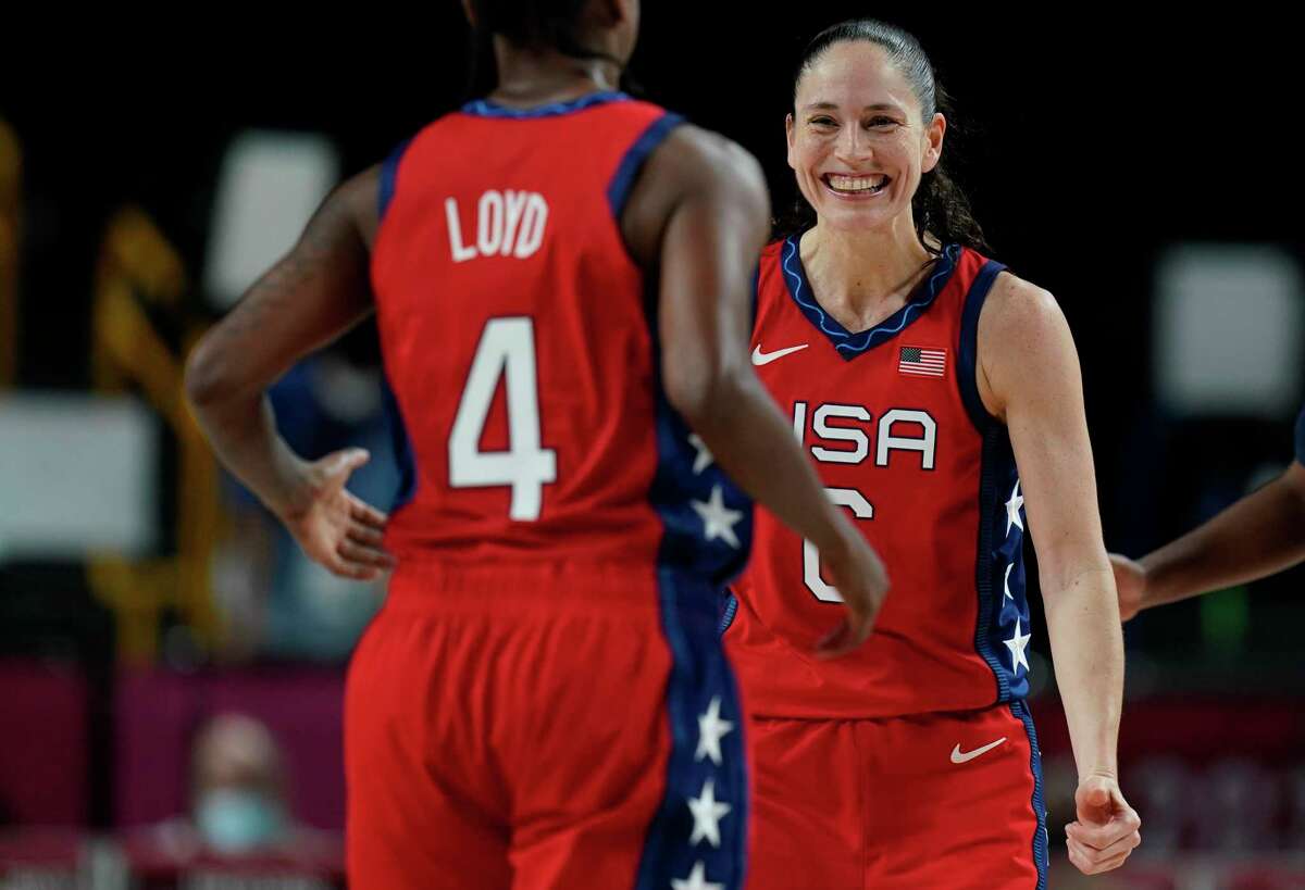 The United States’ Sue Bird (6), right, celebrates a score by teammate Jewell Loyd during a preliminary round game at the 2020 Summer Olympics on Tuesday.