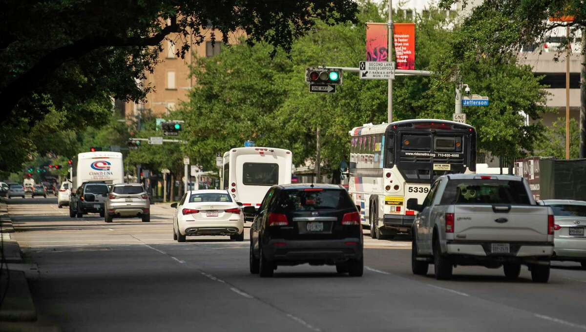 A Metropolitan Transit Authority bus travels north on Travis Street near Metro’s downtown transit center on July 20, 2021, in Houston. Officials plan to paint the right lane on Travis and Milam as a red bus only lane between Pierce and Commerce.