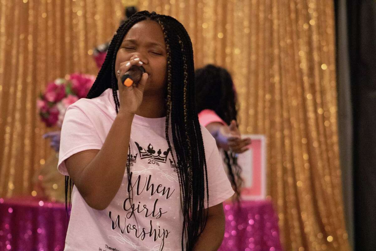 A participant of a When Girls Worship event sings. When Girls Worship is hosting a back to school brunch for girls 13-21 on Aug. 14.