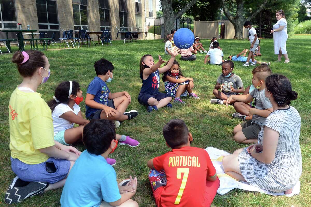 Students from the Horizons program play during an outdoors activity period at Notre Dame High School, in Fairfield, Conn. July 27, 2021.