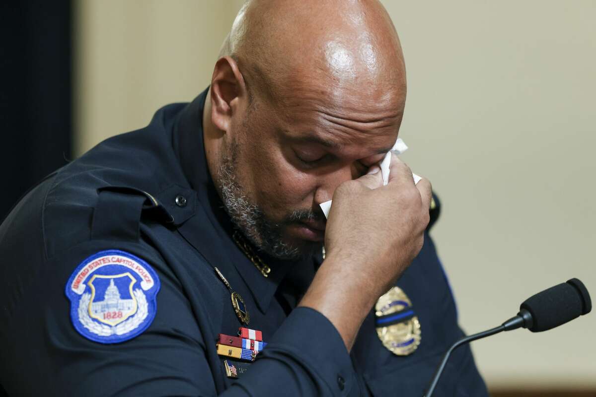 U.S. Capitol Police Sgt. Harry Dunn wipes his eye as he testifies during the House select committee hearing on the Jan. 6 attack on Capitol Hill in Washington, Tuesday, July 27, 2021. (Oliver Contreras/The New York Times via AP, Pool)