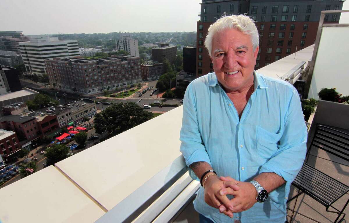 Stamford resident Joe Corsello poses on the roof patio at his apartment building in Stamford, Conn., on Thursday July 15, 2021. Corsello, a Republican, will be running for mayor.