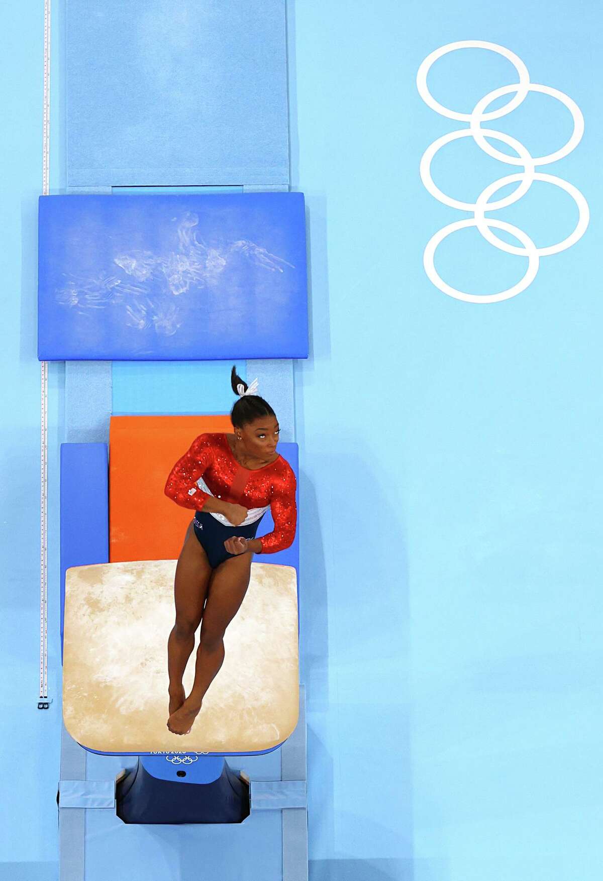 TOKYO, JAPAN - JULY 27: Simone Biles warms up on vault during the Women's Team Final on day four of the Tokyo 2020 Olympic Games at Ariake Gymnastics Centre on July 27, 2021 in Tokyo, Japan. (Photo by Laurence Griffiths/Getty Images)