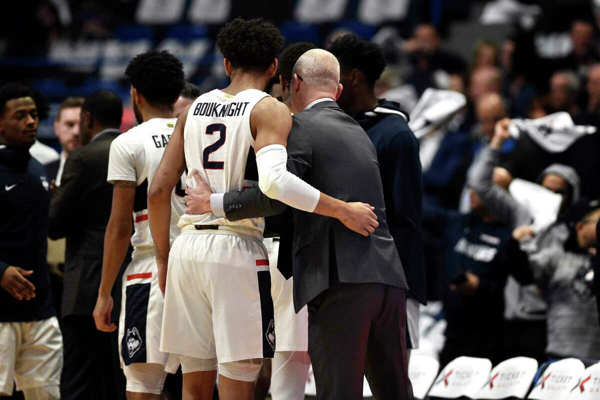 UConn’s James Bouknight and coach Dan Hurley embrace in the first half during a game in 2020 in Hartford.