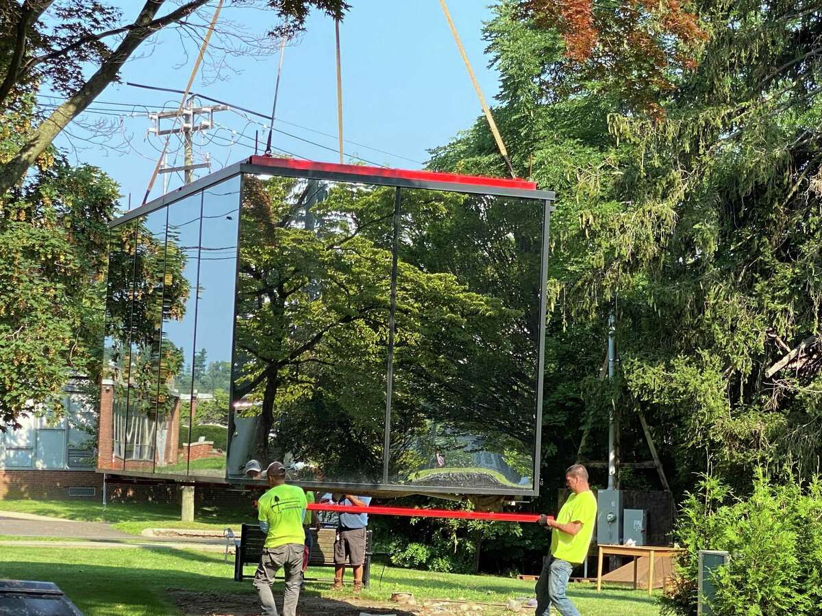 The mirror cube was removed from its home on South Avenue and Maple Street on Tuesday, July 27, where is was used to promote the new New Canaan Library project.
