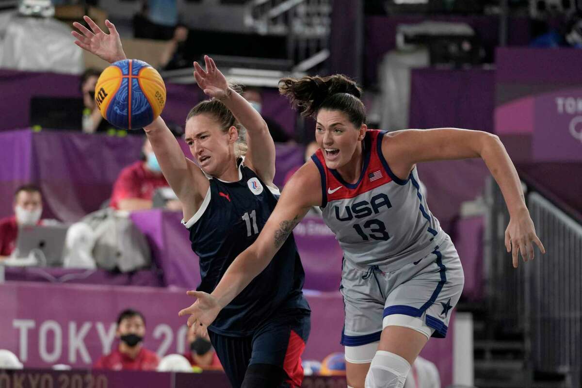 Anastasiia Logunova (11), of the Russian Olympic Committee, and United States’ Stefanie Dolson (13) chase a loose ball during a women’s 3-on-3 gold medal basketball game at the 2020 Summer Olympics, Wednesday, July 28, 2021, in Tokyo.