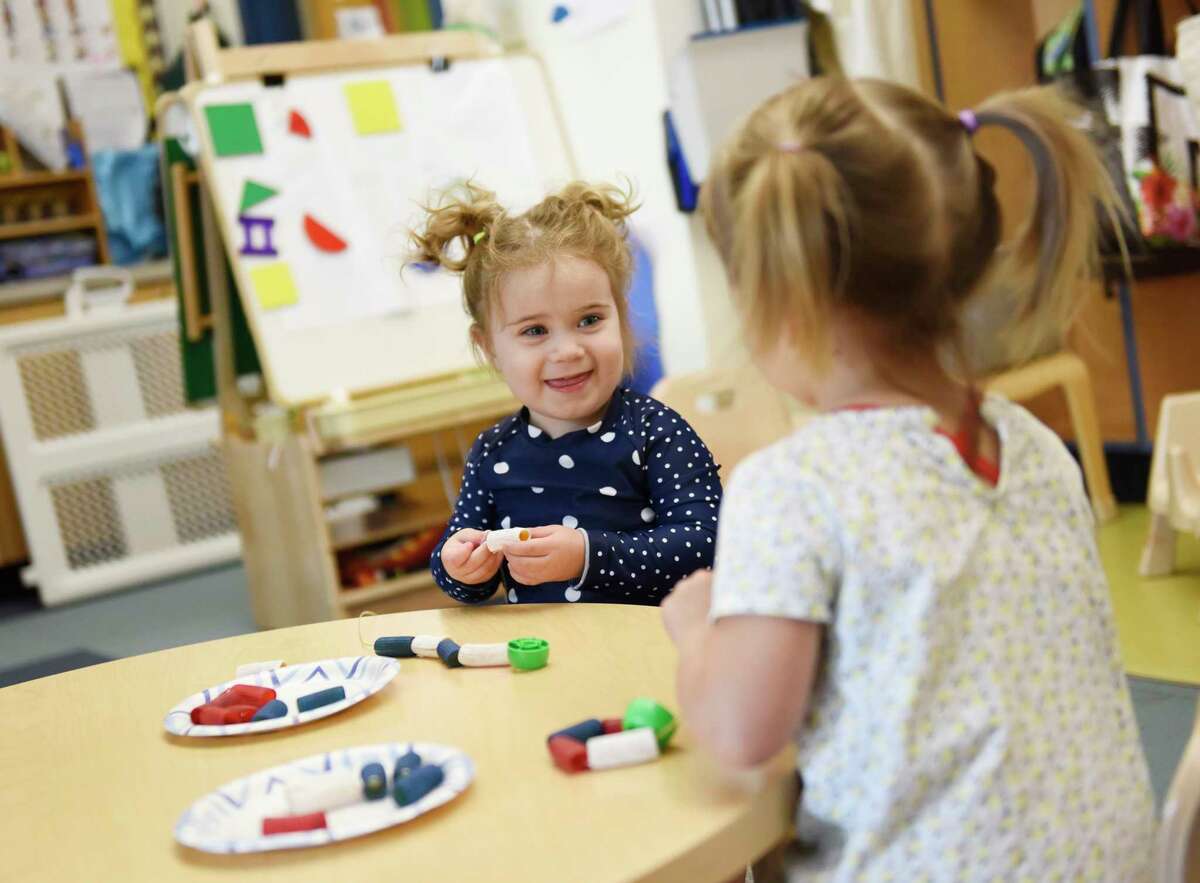 Students play and learn at Temple Sholom's Selma Maisel Nursery School in Greenwich, Conn. Wednesday, July 28, 2021. Even before COVID-19 hit, quality day care centers were in high demand. Now, with parents returning to work, it has been difficult for many to find childcare openings in the area.